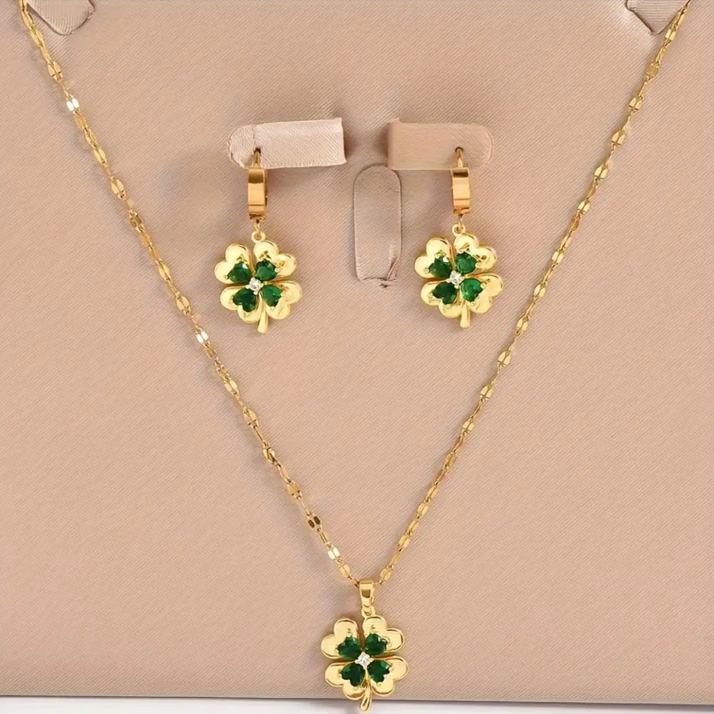 Set joyería dorada tréboles cristales verdes Colombia